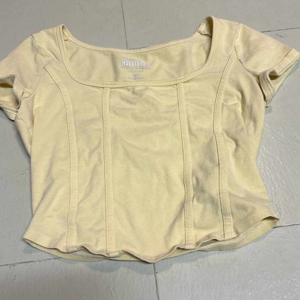 Hollister yellow top.